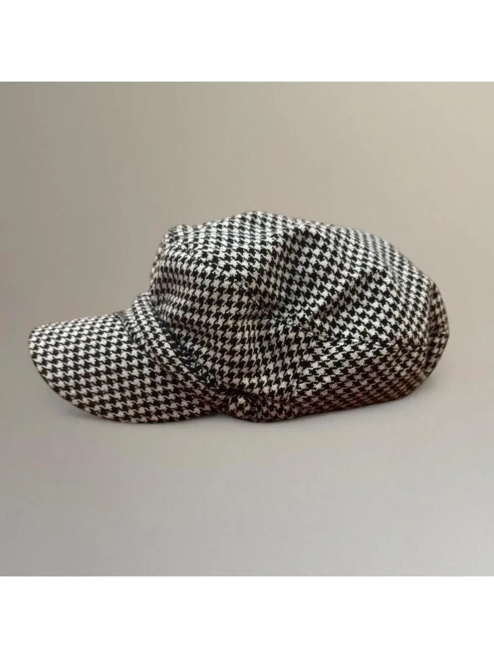 Houndstooth newsboy cap.